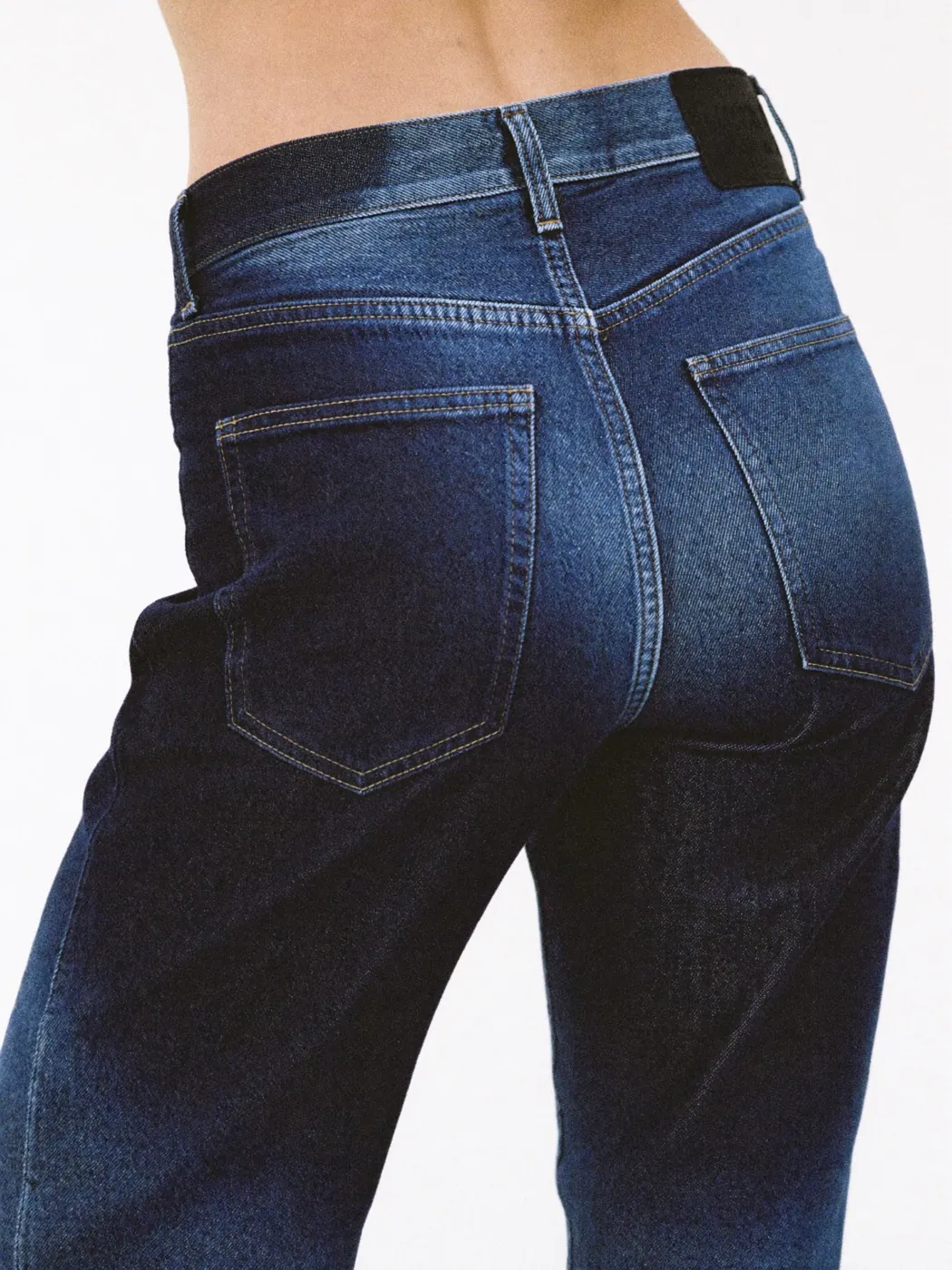 Anthroutfit lookbook: close detail of a denim waistband, the point where jeans sizing differs between brands